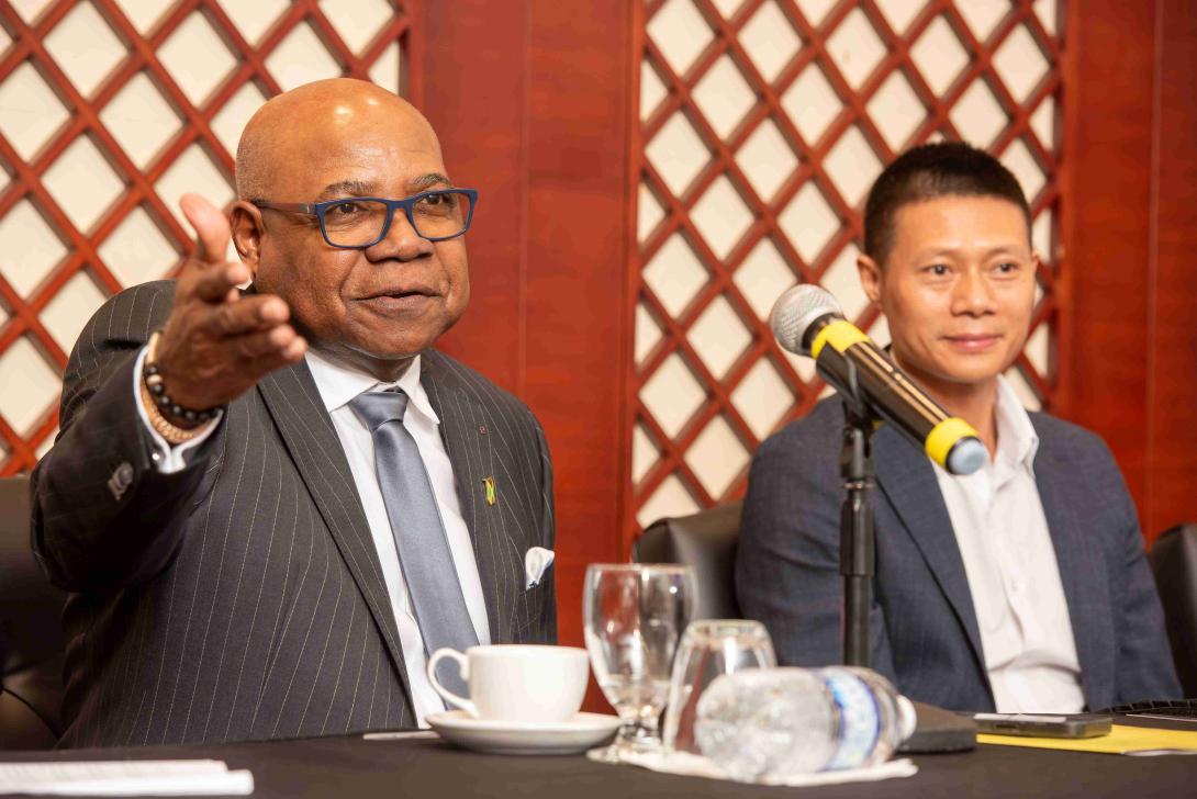 Minister of Tourism, Hon. Edmund Bartlett (left) responds to questions following his keynote address at the ground-breaking Pinnacle conference on branded real estate development, on Wednesday, December 4, 2024 at the Montego Bay Convention Centre. Beside him is Yangsen Li, Chief Executive Officer of LCH Developments, developers of the US$450 million Pinnacle luxury lifestyle property.